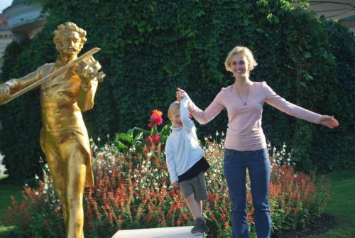 By-the-sculpture-of-Johann-Strauss,-Jr.-in-Austria-min